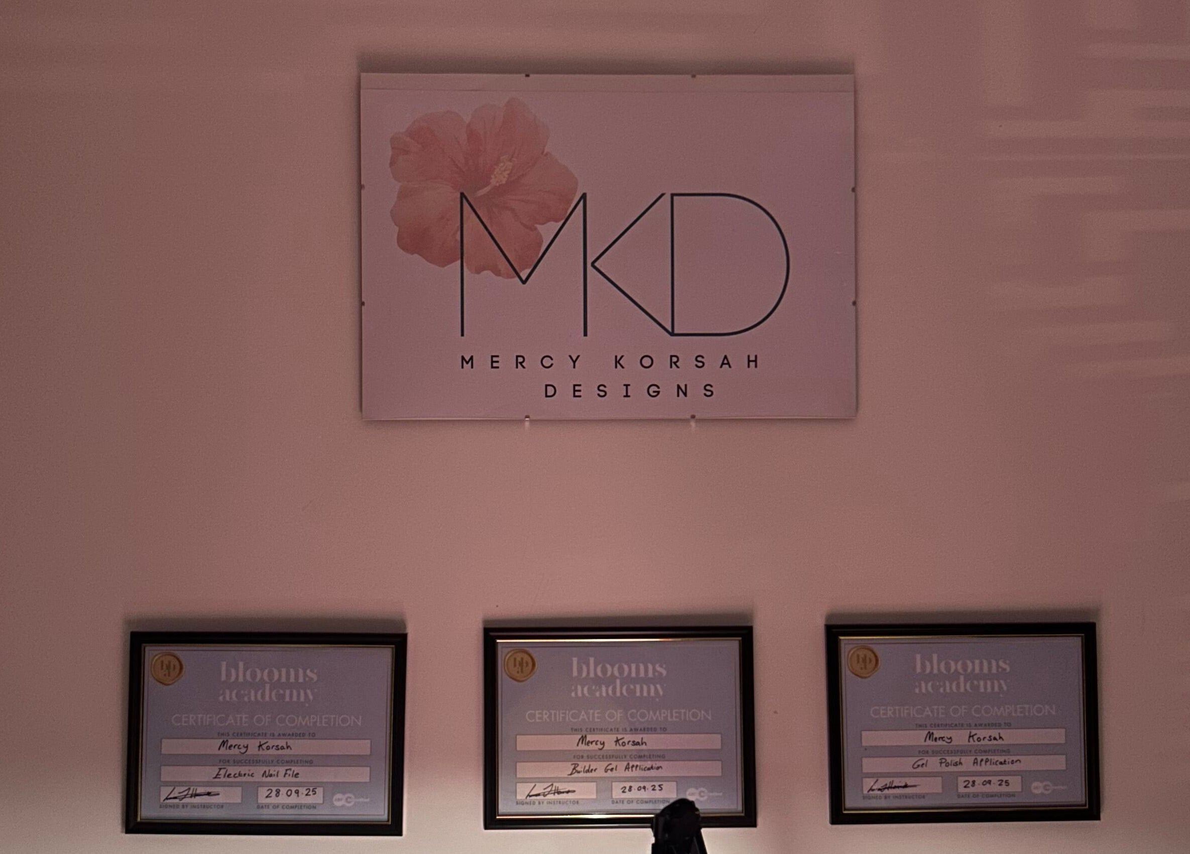 MKDesigns certifications wall in Harlow, England, GB, showcasing elegant design and professionalism.