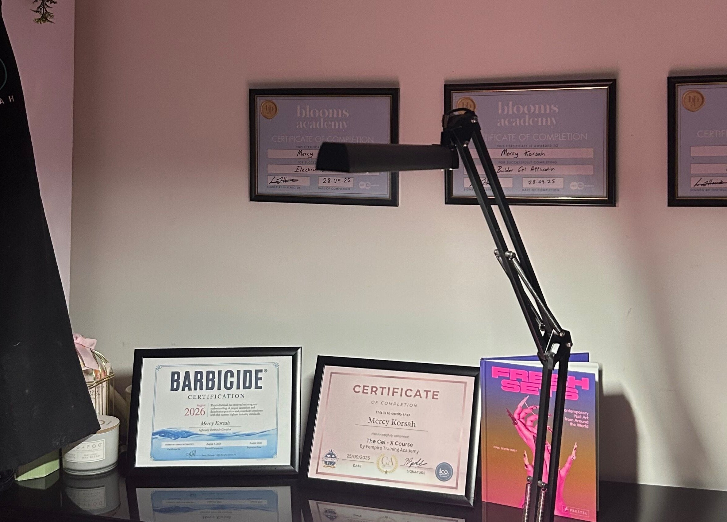Framed certificates on display at MKDesigns, Harlow, England, GB, showcasing professional achievements.