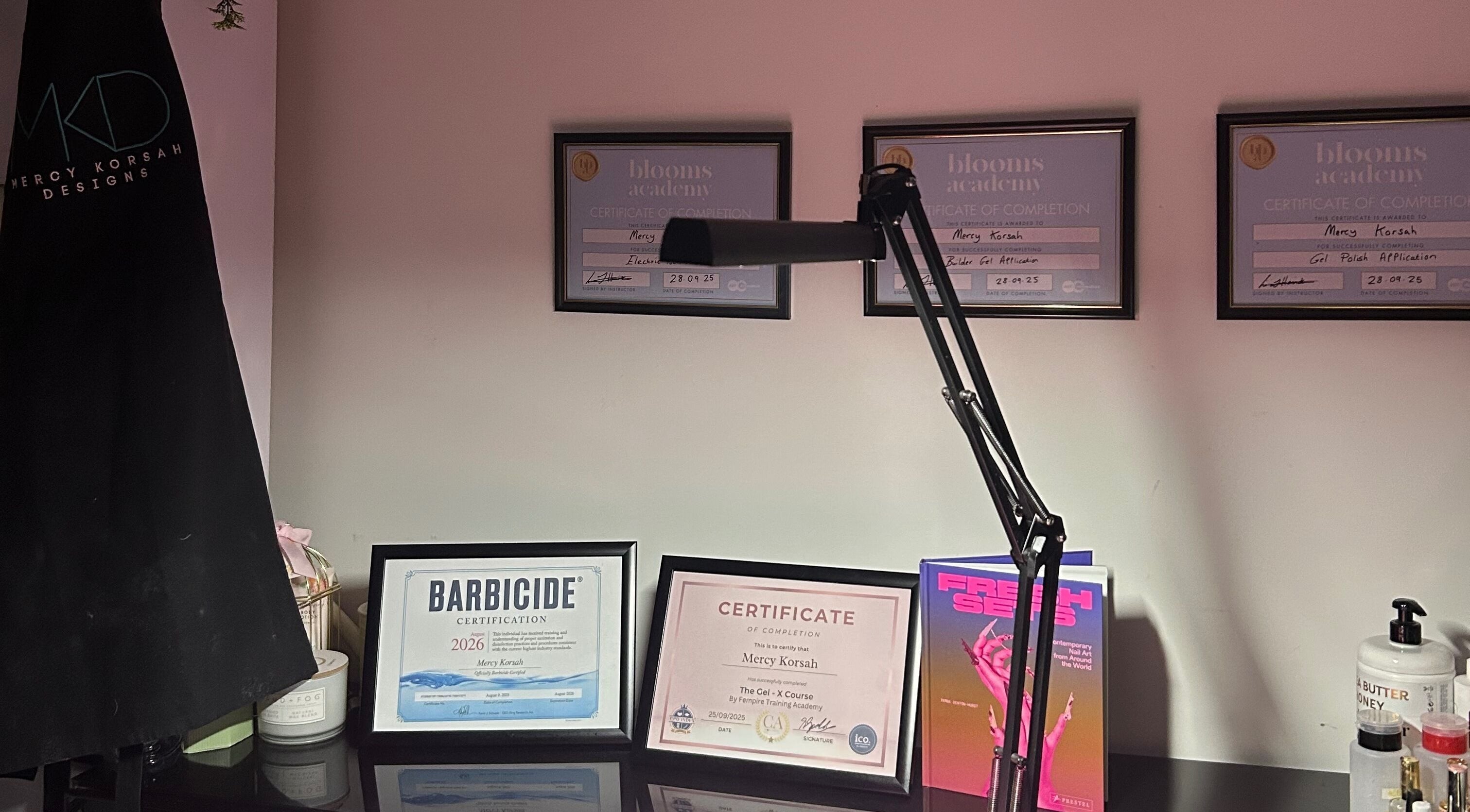 Framed certificates on display at MKDesigns, Harlow, England, GB, showcasing professional achievements.