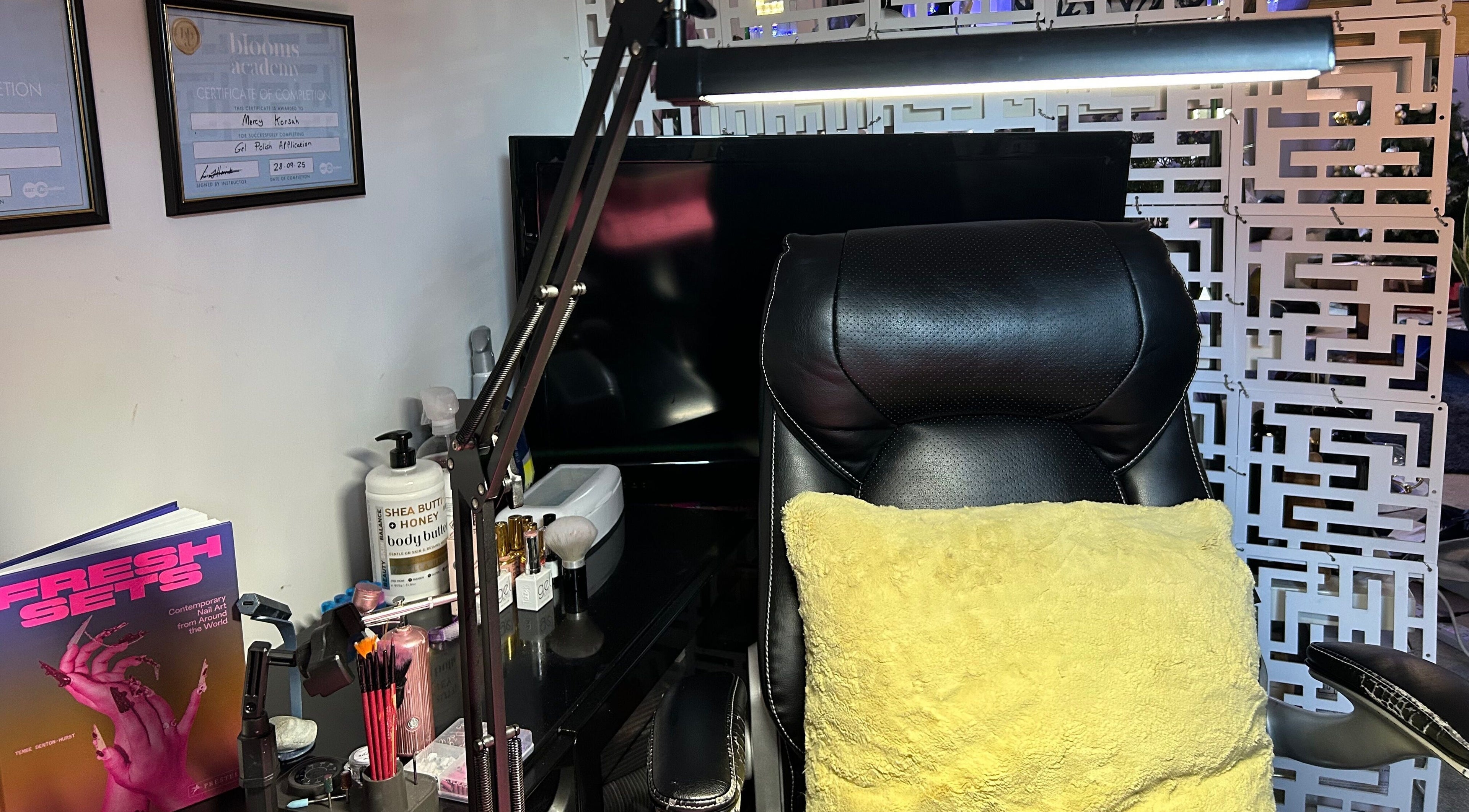 Professional beauty setup at MKDesigns, Harlow, England, GB, featuring a plush chair and beauty tools.