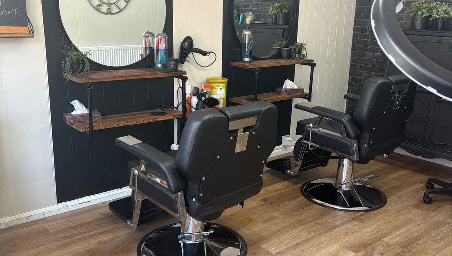 Modern salon chairs at Cuts by Amy in Earls Colne, England, GB, highlighting chic interior design.