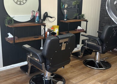 Modern salon chairs at Cuts by Amy in Earls Colne, England, GB, highlighting chic interior design.