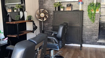 Chic interior of Cuts by Amy in Earls Colne, England, GB featuring stylish barber chairs and decor.