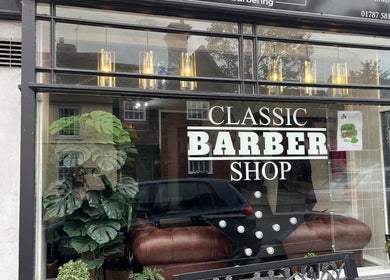 Front view of Cuts by Amy in Earls Colne, England, GB with classic barber shop sign.