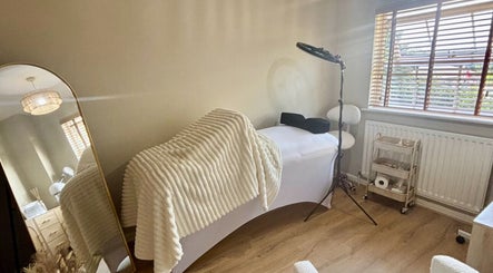 Cozy treatment room at Skin Therapy by Kiren in Woodley, England, GB with a comfortable massage bed.