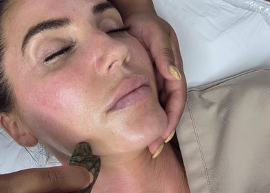 Facial treatment with Gua Sha at Skin Therapy by Kiren, Woodley, England, GB. Enhancing beauty and wellness.