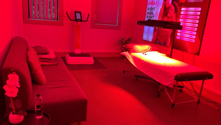 Relaxing treatment room at Dr Marco Maruggi Chiropractor MedWave, Randburg, Gauteng, ZA with a red-lit ambiance.