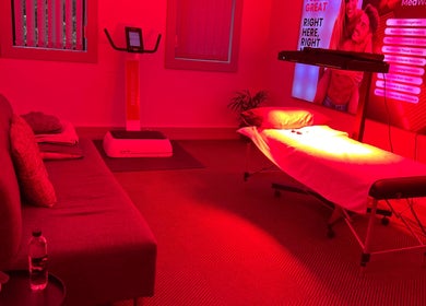 Relaxing treatment room at Dr Marco Maruggi Chiropractor MedWave, Randburg, Gauteng, ZA with a red-lit ambiance.