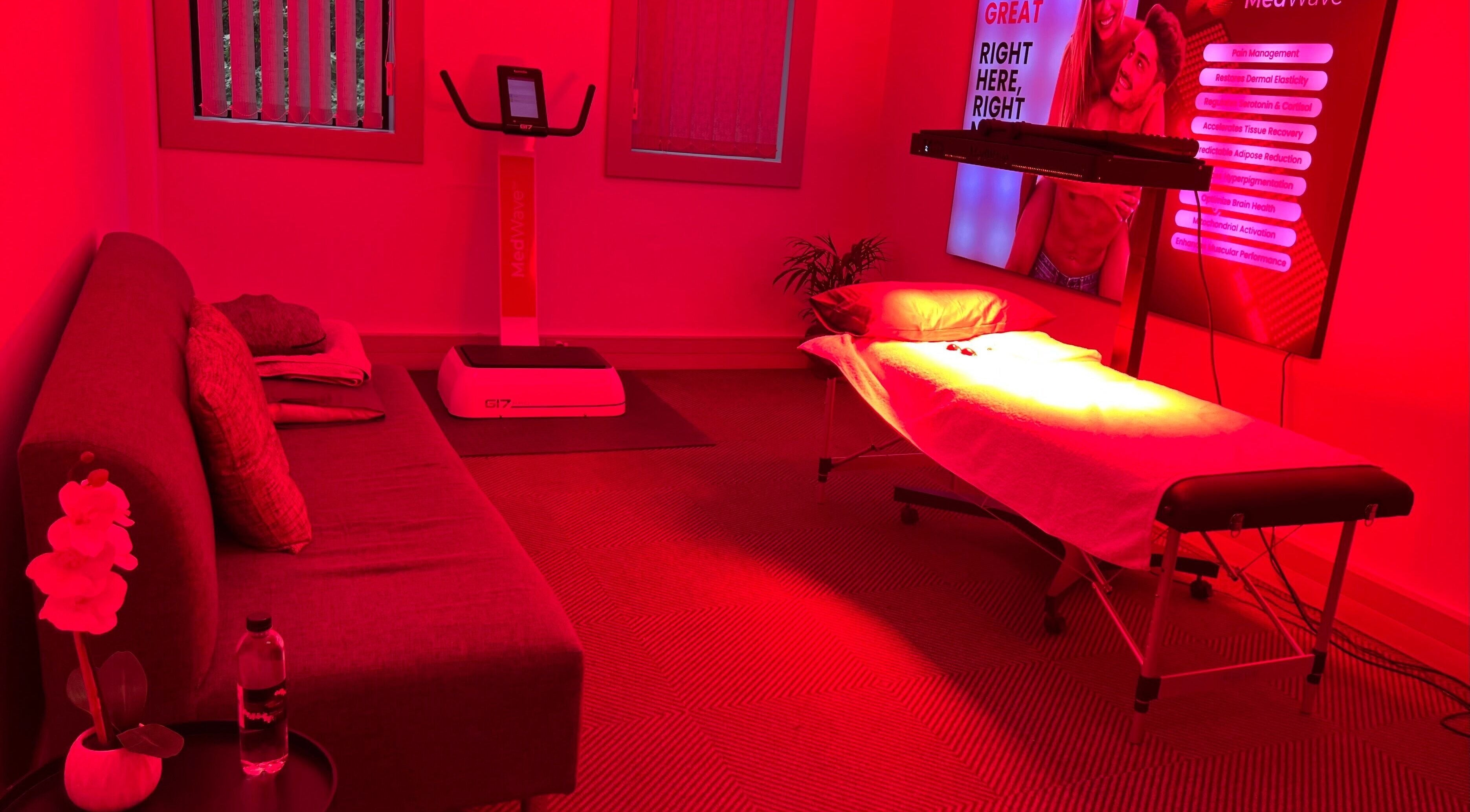 Relaxing treatment room at Dr Marco Maruggi Chiropractor MedWave, Randburg, Gauteng, ZA with a red-lit ambiance.