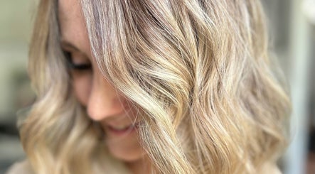 Close-up of wavy blonde hairstyle at Rachael @seventysix, Dunmow, England, GB, showcasing expert styling.