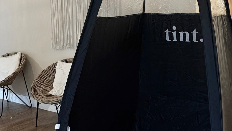 Comfortable seating and tanning booth at The Tanned Society, Brentwood, England, GB.