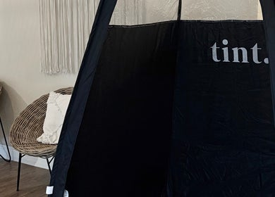 Comfortable seating and tanning booth at The Tanned Society, Brentwood, England, GB.