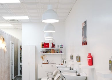 Modern salon interior at Classic Beauty Studio, New York, New York, US featuring chic washing stations and stylish decor.