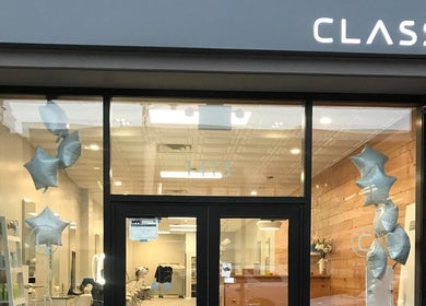 Front view of Classic Beauty Studio in New York, New York, US, showcasing elegant design with star balloons.