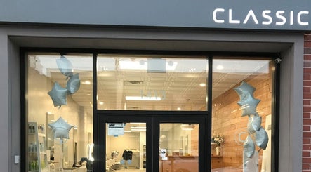 Front view of Classic Beauty Studio in New York, New York, US, showcasing elegant design with star balloons.