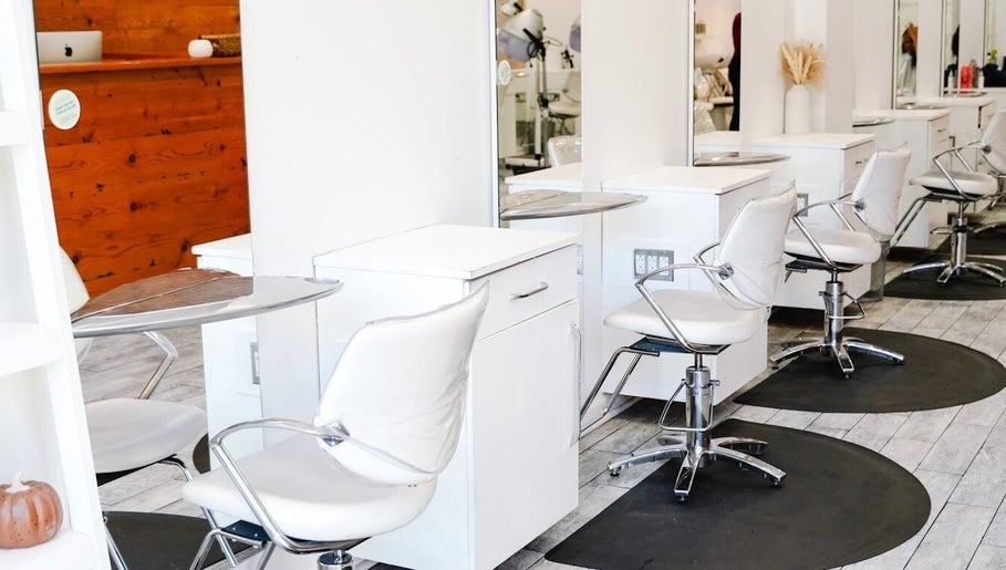 Sleek salon chairs and mirrors at Classic Beauty Studio in New York, New York, US, exuding modern elegance.