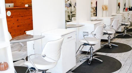 Sleek salon chairs and mirrors at Classic Beauty Studio in New York, New York, US, exuding modern elegance.