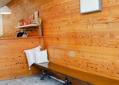 Warm wooden reception area at Classic Beauty Studio, New York, New York, US, inviting and cozy ambience.