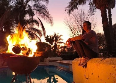 Peaceful outdoor fire at Omar Beauty Spa, Chartwell, Gauteng, ZA, enhancing relaxation in natural surroundings.