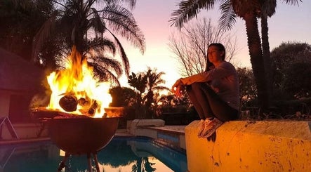 Peaceful outdoor fire at Omar Beauty Spa, Chartwell, Gauteng, ZA, enhancing relaxation in natural surroundings.
