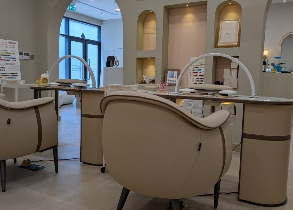 Elegant nail station at Sheboss Timeless Beauty Saloon LLC, Dubai, AE featuring modern, comfortable seating.