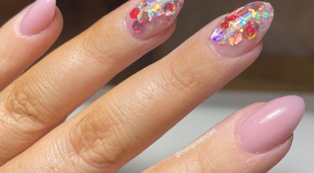 Elegant pink nails with sparkling glitter design at Ceri Elizabeth Nail Queen, Belfast, Northern Ireland, GB.