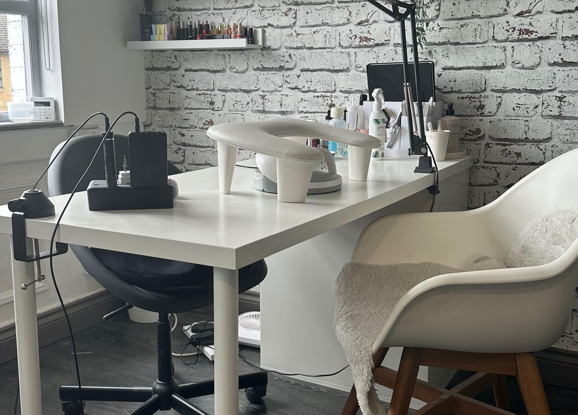Cozy nail salon at Ceri Elizabeth Nail Queen in Belfast, Northern Ireland, GB with modern decor and manicure setup.