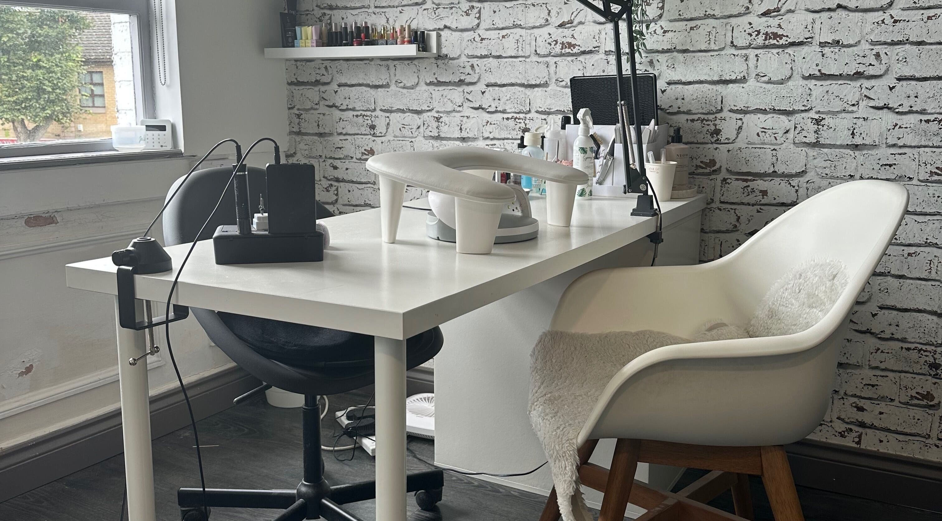 Cozy nail salon at Ceri Elizabeth Nail Queen in Belfast, Northern Ireland, GB with modern decor and manicure setup.