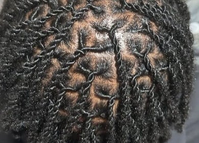 Close-up of intricate hair twists at Beestyles0 in Savannah, Georgia, US, showcasing detailed hair styling.