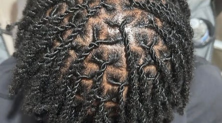 Close-up of intricate hair twists at Beestyles0 in Savannah, Georgia, US, showcasing detailed hair styling.