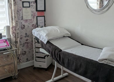 Cozy treatment room at Emma's Beauty Room, Southampton, England, GB. Plush bed and stylish decor for relaxation.