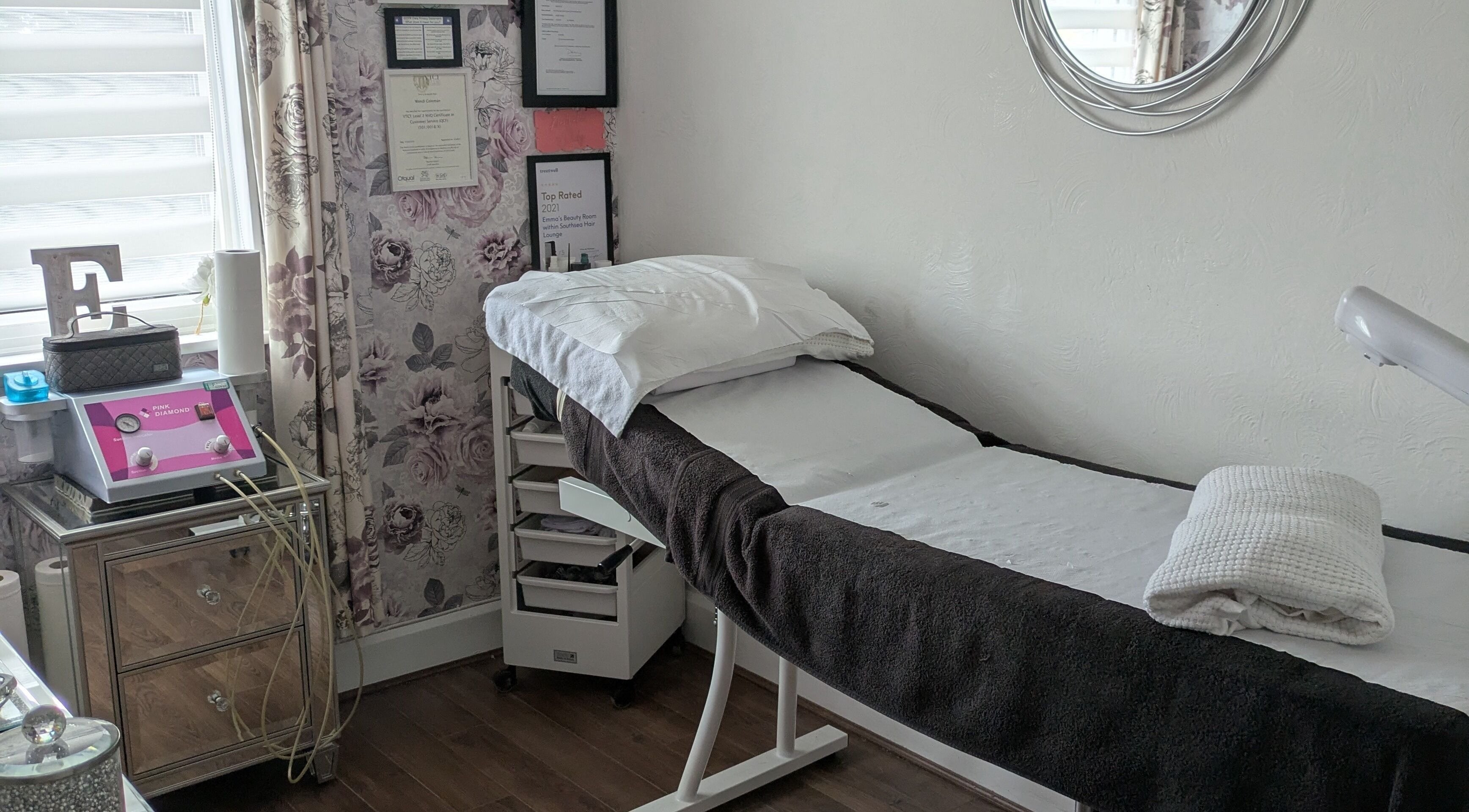 Cozy treatment room at Emma's Beauty Room, Southampton, England, GB. Plush bed and stylish decor for relaxation.