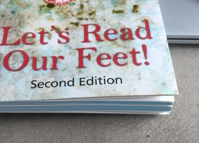 Foot reading book at Beauty Room at Emma's Beauty Room, Southampton, England, GB.