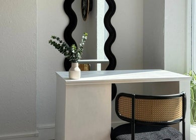 Elegant nail station at Aura Nail Studio, Leek, England, GB with mirror and greenery.