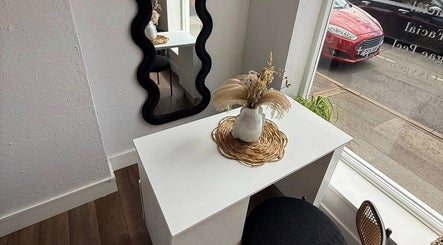 Elegant setup at Aura Nail Studio in Leek, England, GB featuring a stylish white table and decor.
