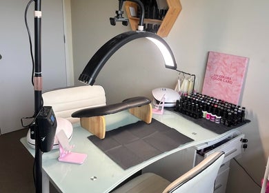 Flawless Finish nail station in Leithfield, Canterbury Region, NZ, showcasing manicure tools and polishes.