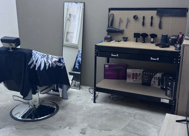 Modern barbershop setup at BobbyCutz, Gabrovo, Gabrovo, BG featuring a stylist chair and tools.