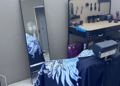Modern barber station at BobbyCutz, Gabrovo, Gabrovo, BG featuring a stylish chair and organized grooming tools.