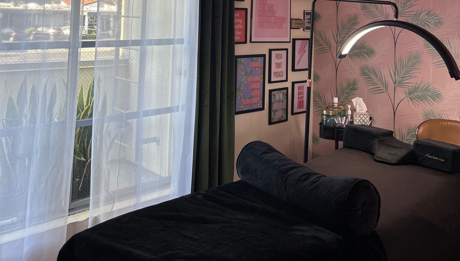 Cozy treatment room at The Luxe Lash Studio, Dana Point, California, US with modern decor and soft lighting.