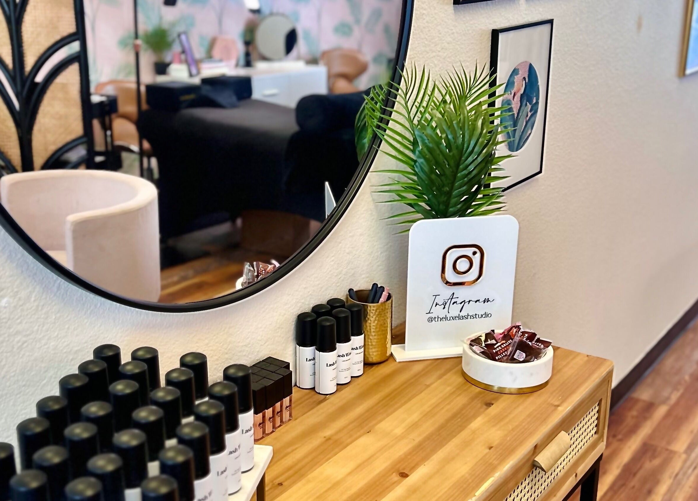 Chic interior of The Luxe Lash Studio, Dana Point, California, with modern decor and beauty products showcased.