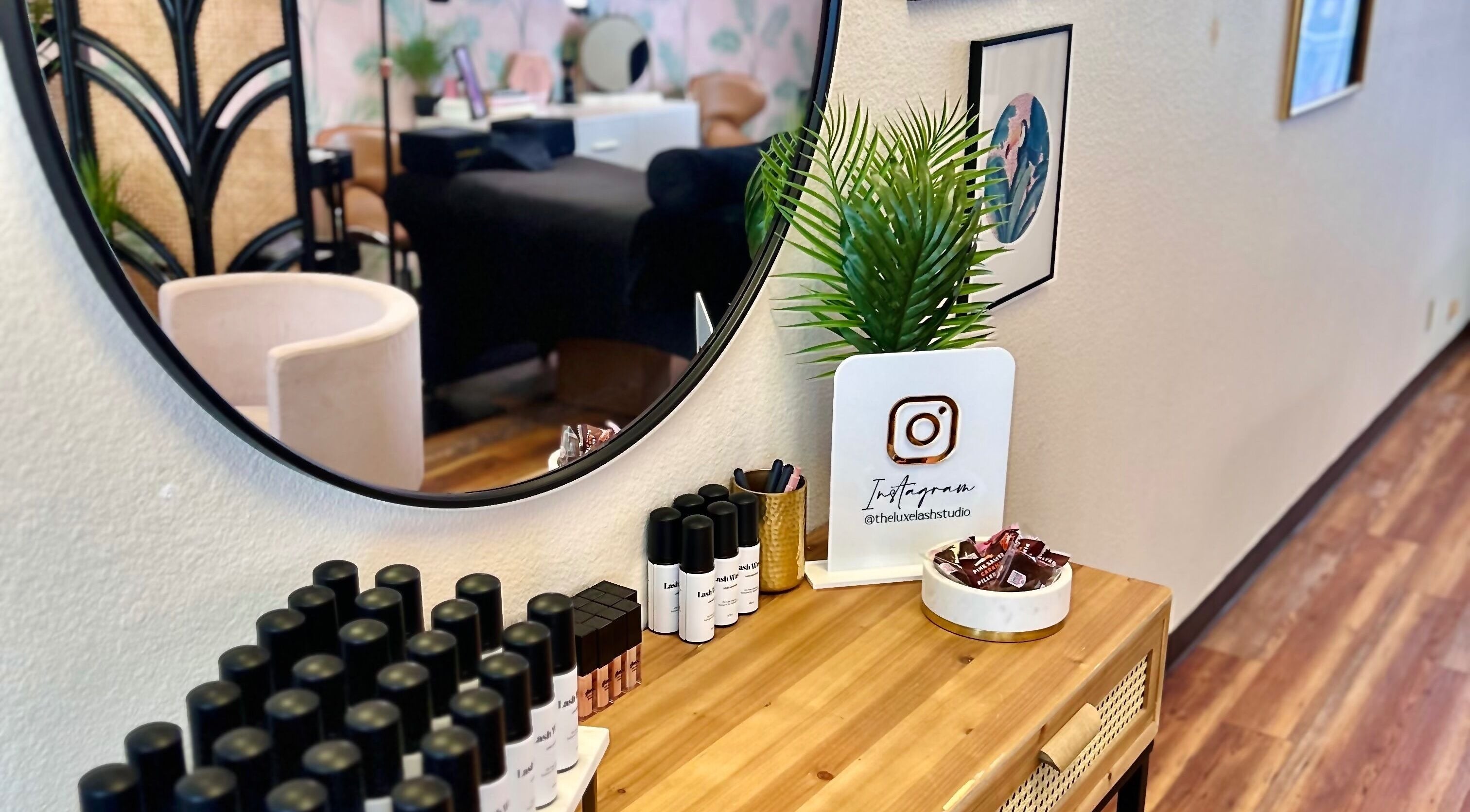 Chic interior of The Luxe Lash Studio, Dana Point, California, with modern decor and beauty products showcased.
