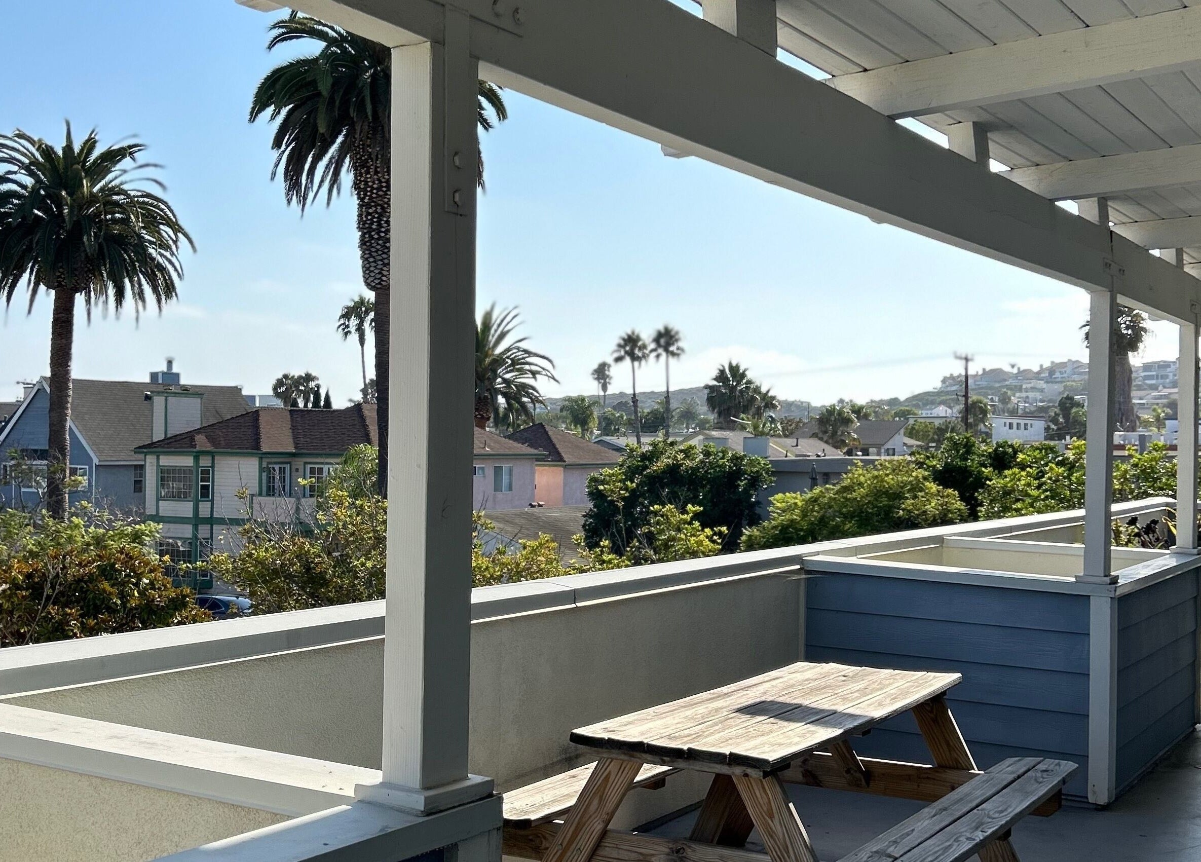 Relaxing view from the deck at The Luxe Lash Studio, Dana Point, California, US showcasing palm trees.