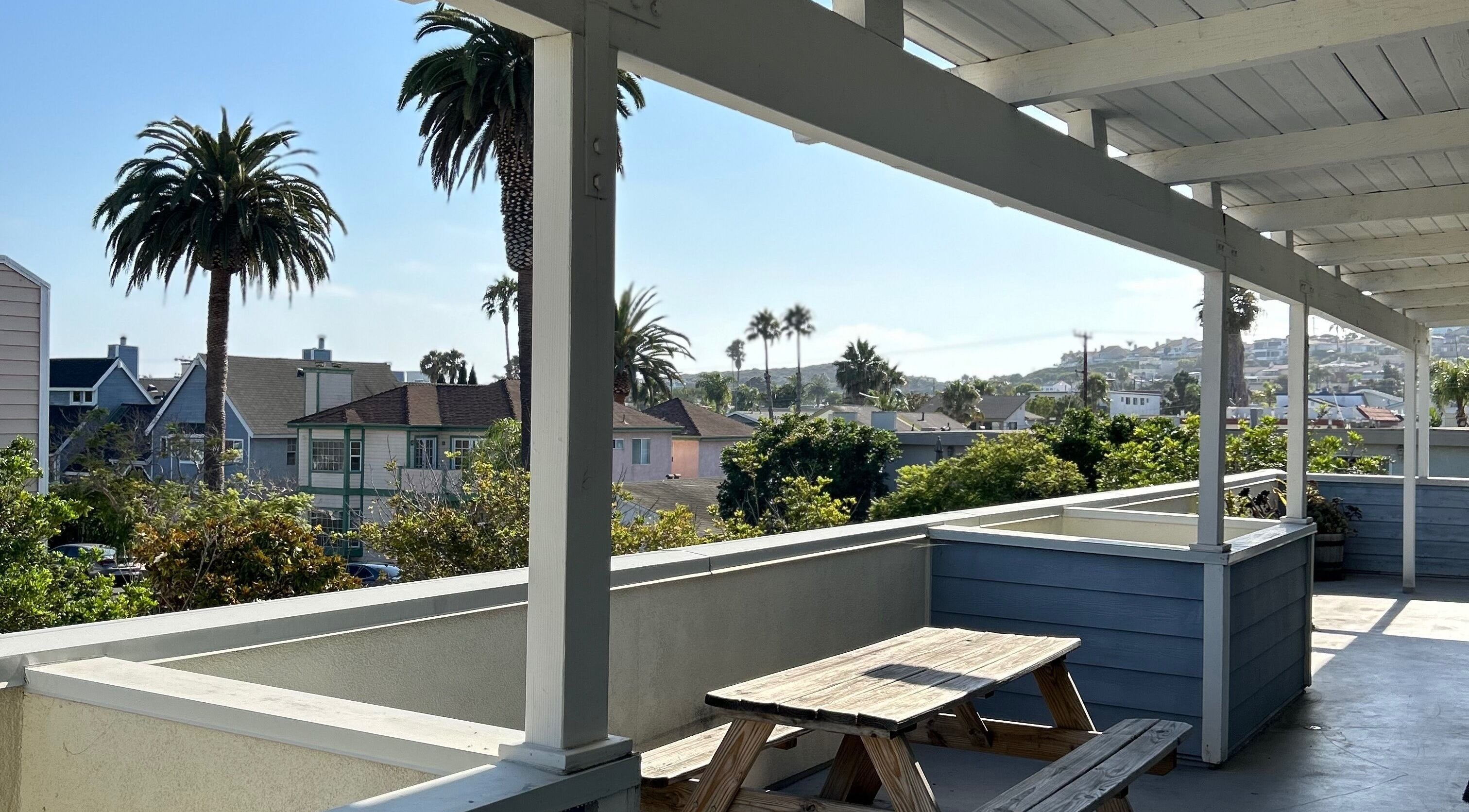 Relaxing view from the deck at The Luxe Lash Studio, Dana Point, California, US showcasing palm trees.