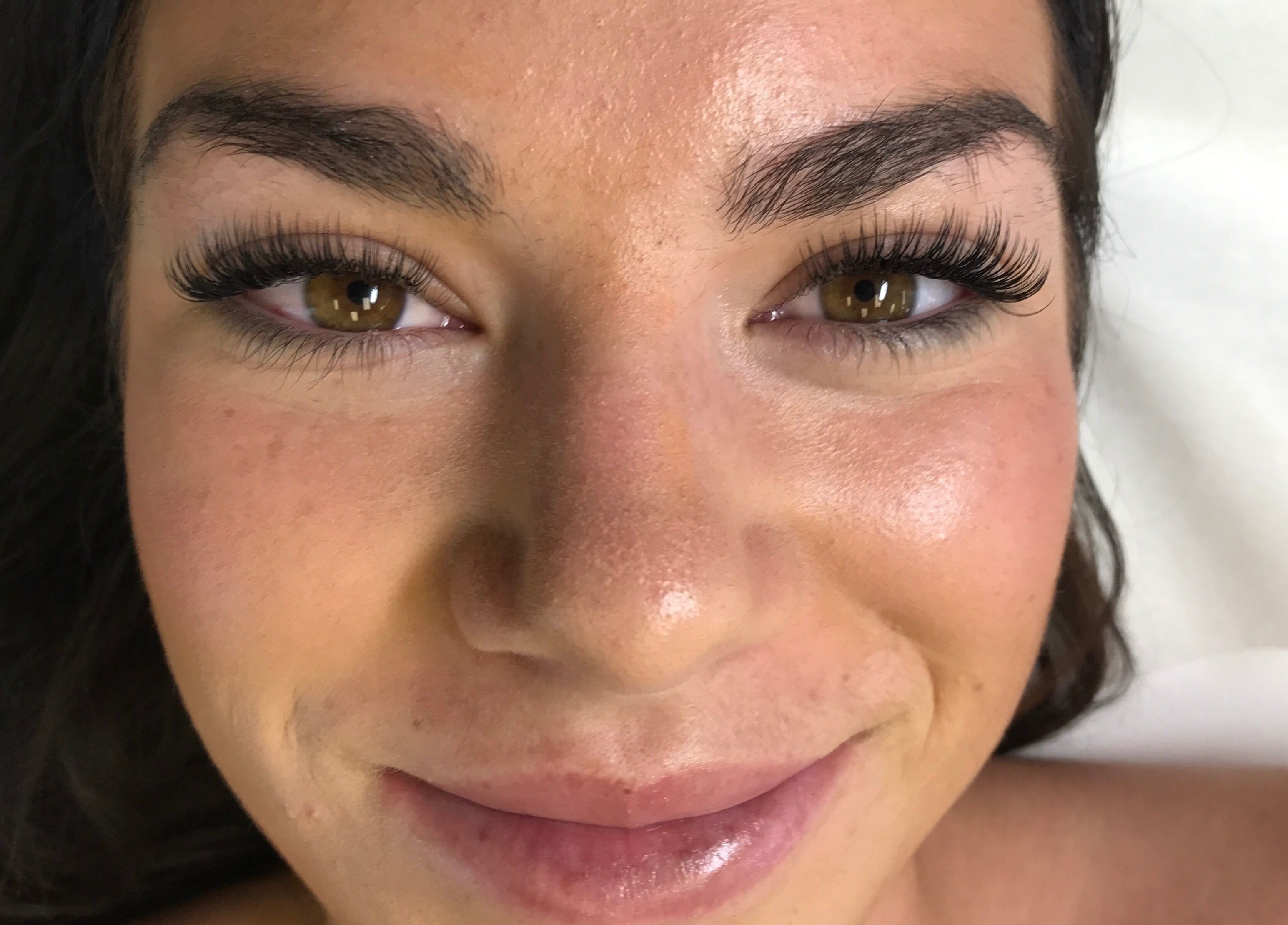 Client with lush eyelash extensions at The Luxe Lash Studio in Dana Point, California, US.