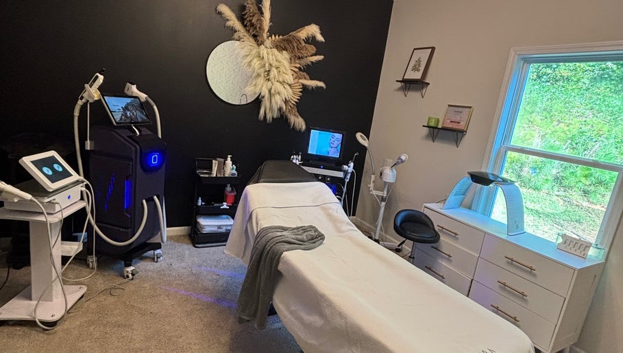 Elegant treatment room at Hola Skin & Beauty in Temple, Georgia, US, featuring modern equipment and soothing decor.
