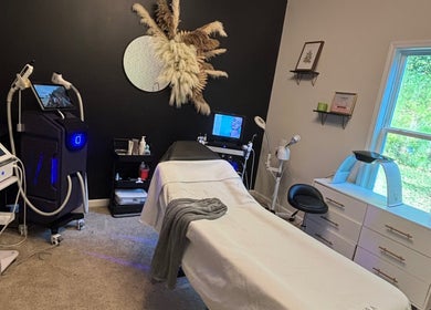 Elegant treatment room at Hola Skin & Beauty in Temple, Georgia, US, featuring modern equipment and soothing decor.