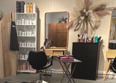 Elegant beauty station at Hola Skin & Beauty in Temple, Georgia, US, showcasing salon products and modern decor.
