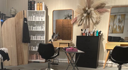 Elegant beauty station at Hola Skin & Beauty in Temple, Georgia, US, showcasing salon products and modern decor.