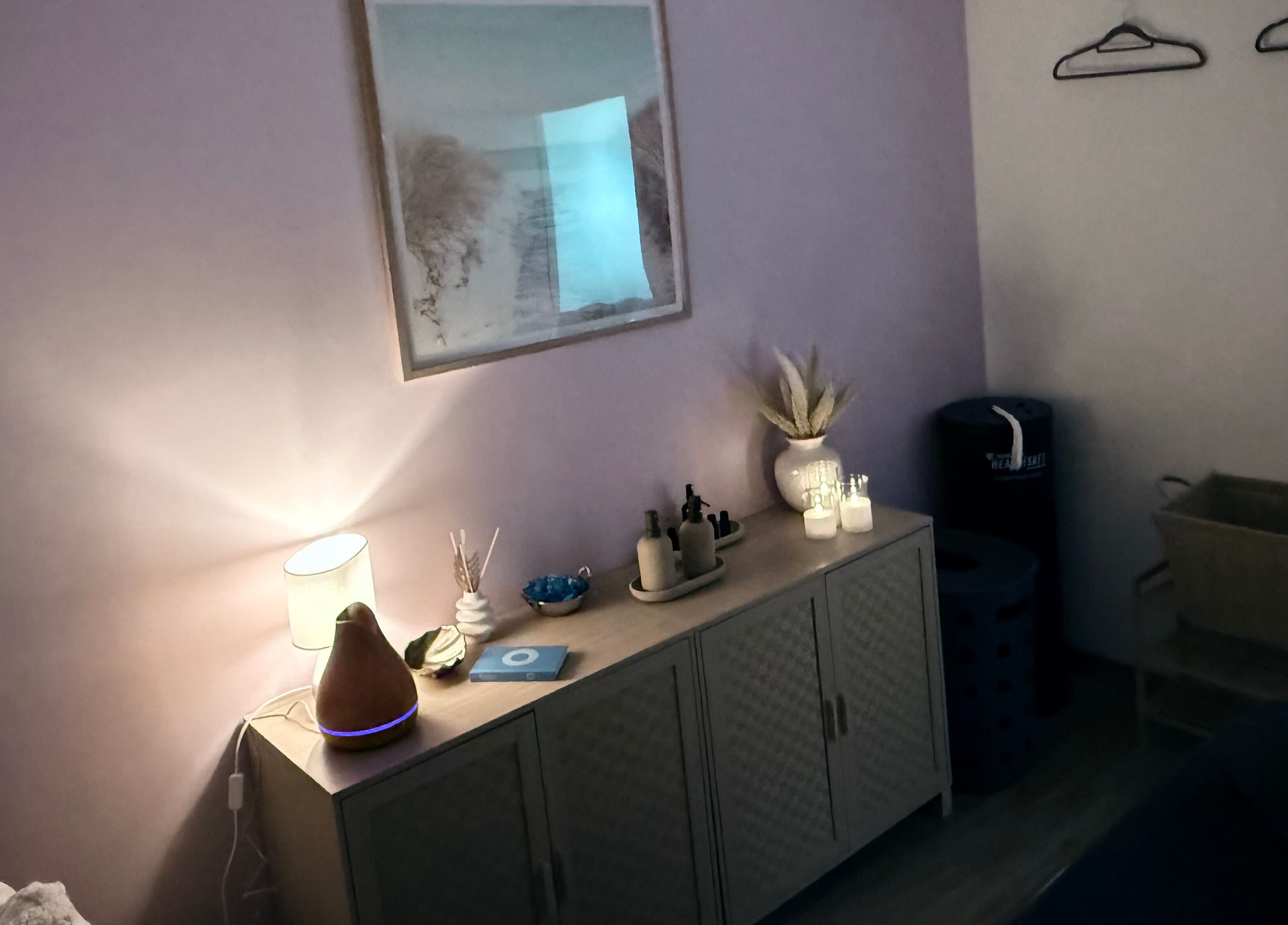 Cozy massage room at ChasingBetter247 Massage, Malaga, Western Australia, AU, with soft lighting and relaxing decor.
