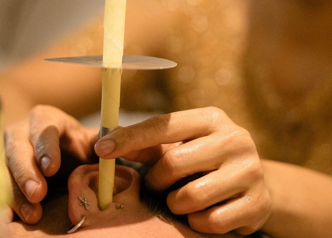 Ear candling at ChasingBetter247 Massage in Malaga, Western Australia, AU, providing soothing holistic therapy.
